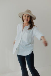 Life coach and business mentor smiling during personal branding photoshoot in Hudson Valley with Pine & Fable Photography.