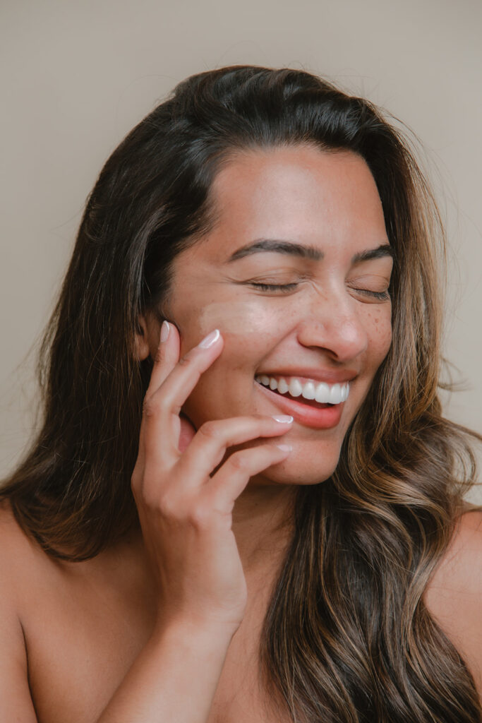 Professional model posing during a TiZO Skincare commercial photoshoot in Hudson Valley, photographed by Julieanne Browning of Pine & Fable Photography.