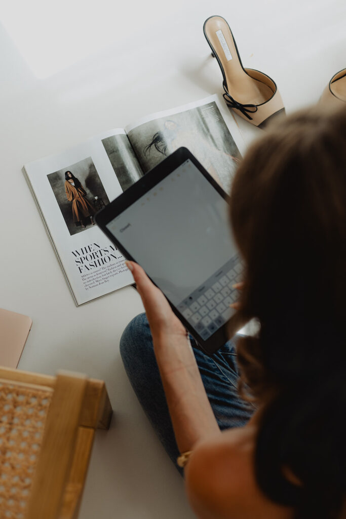 Women typing n her tablet during a branding photoshoot in Hudson Valley, photographed by Julieanne Browning of Pine & Fable Photography.